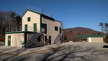 Green and tan burn building at the Fire Training Facility
